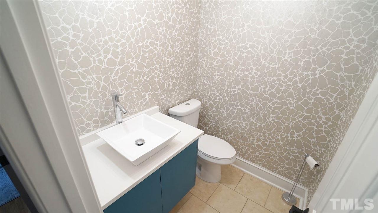 10517 Whitestone Road Raleigh, NC 27615 - Photo 15 of 30 Remodeled 1/2 Bath, perfect location between kitchen and dining room.