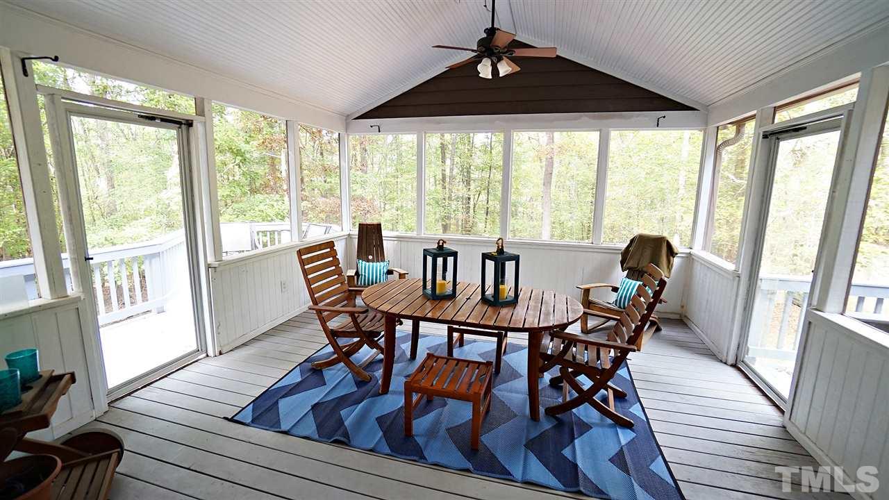 10517 Whitestone Road Raleigh, NC 27615 - Photo 24 of 30 Go from the living room to the screened porch that overlooks a private yard.