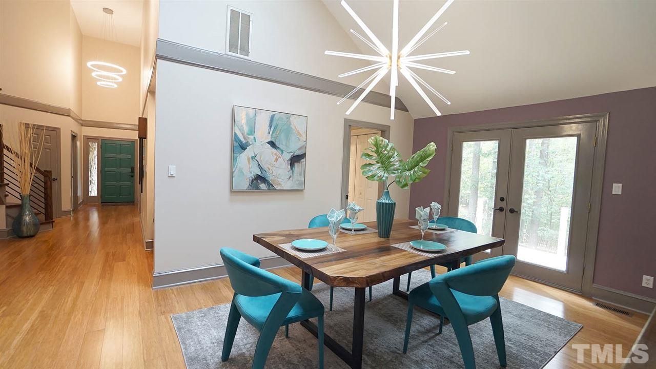 10517 Whitestone Road Raleigh, NC 27615 - Photo 4 of 30 Spacious dining room off kitchen has an exterior door that extends to a new deck area for easy access to grill and the deck also extends to the screened porch.