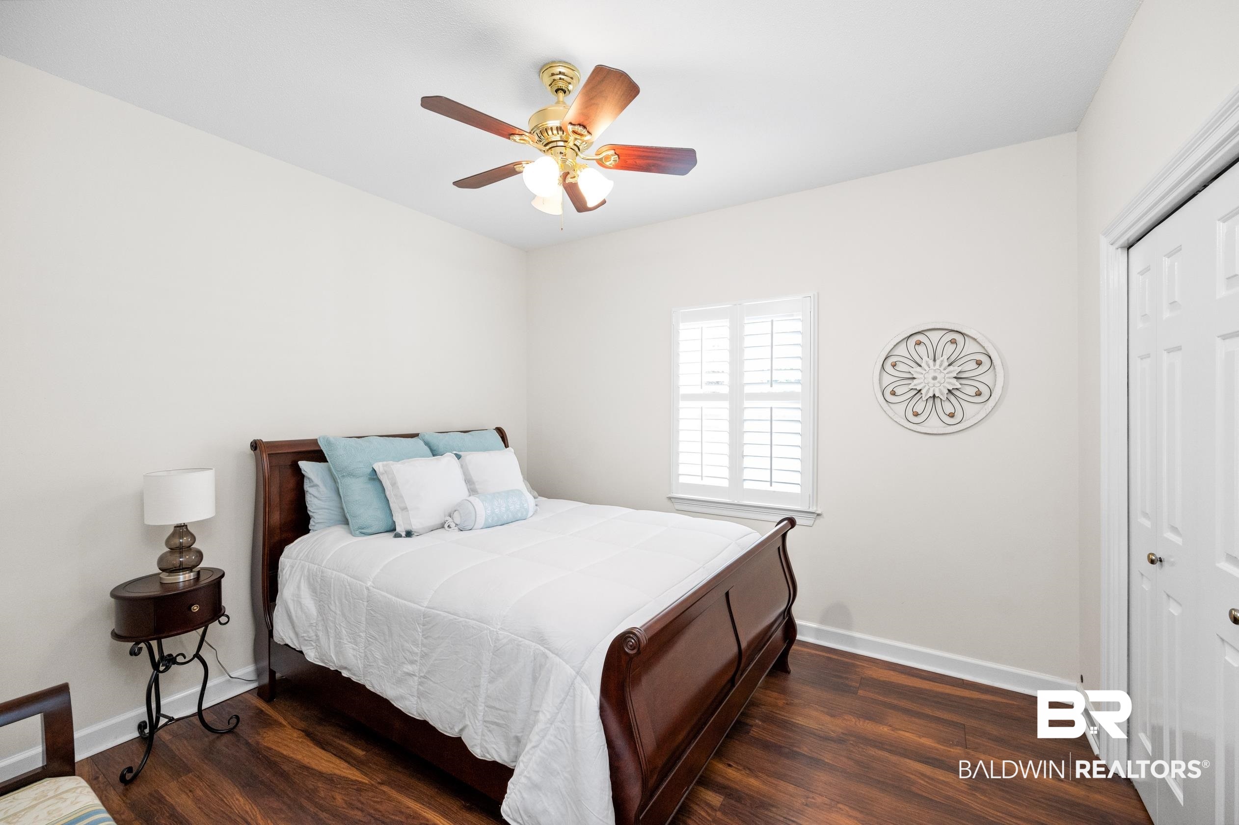 6638 Jackson Square Daphne, AL 36526 - Photo 26 of 62 Bedroom with dark hardwood / wood-style flooring, a closet, and ceiling fan