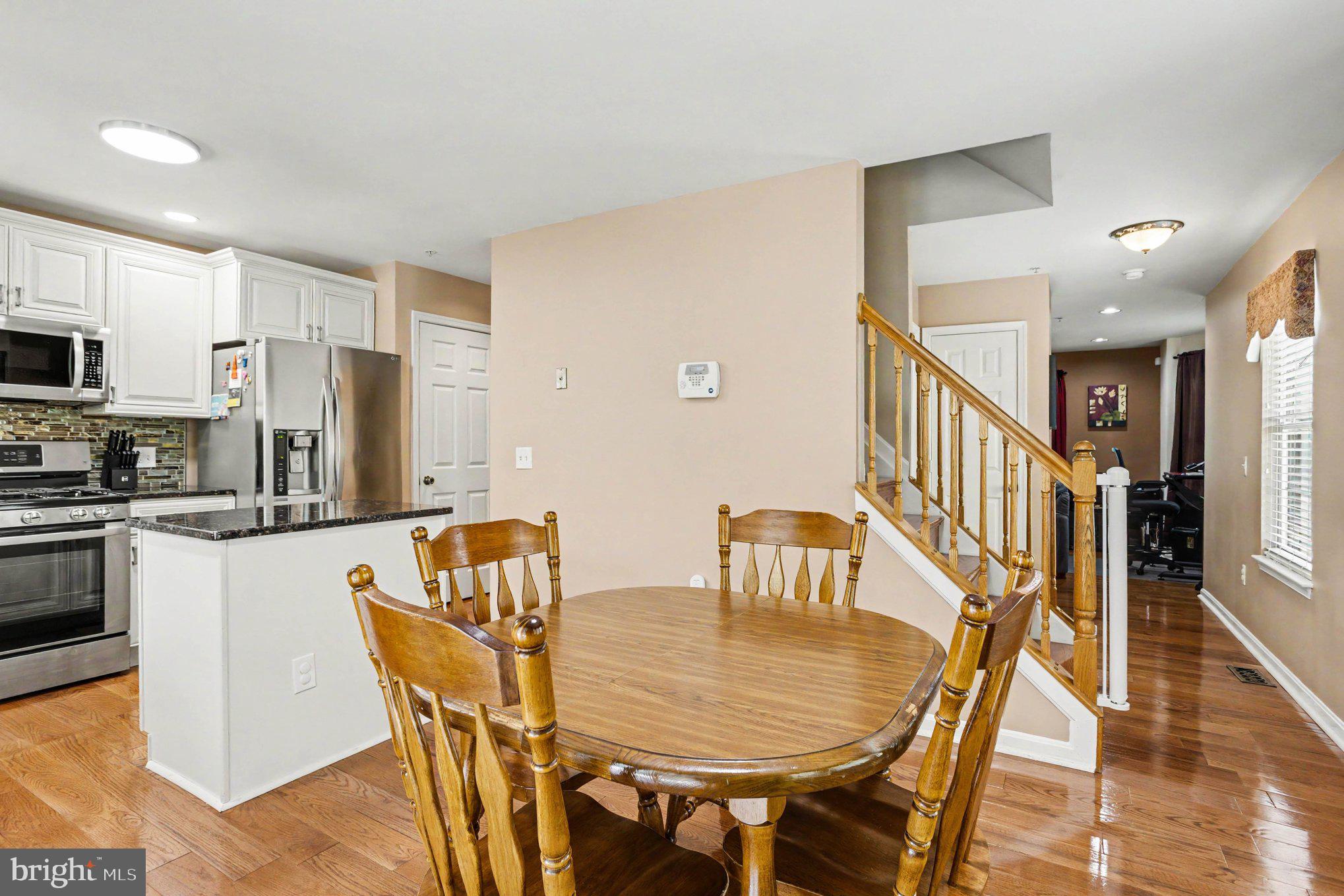 6513 Ridgeborne Drive Baltimore, MD 21237 - Photo 7 of 38 Inviting kitchen with warm wood accents.