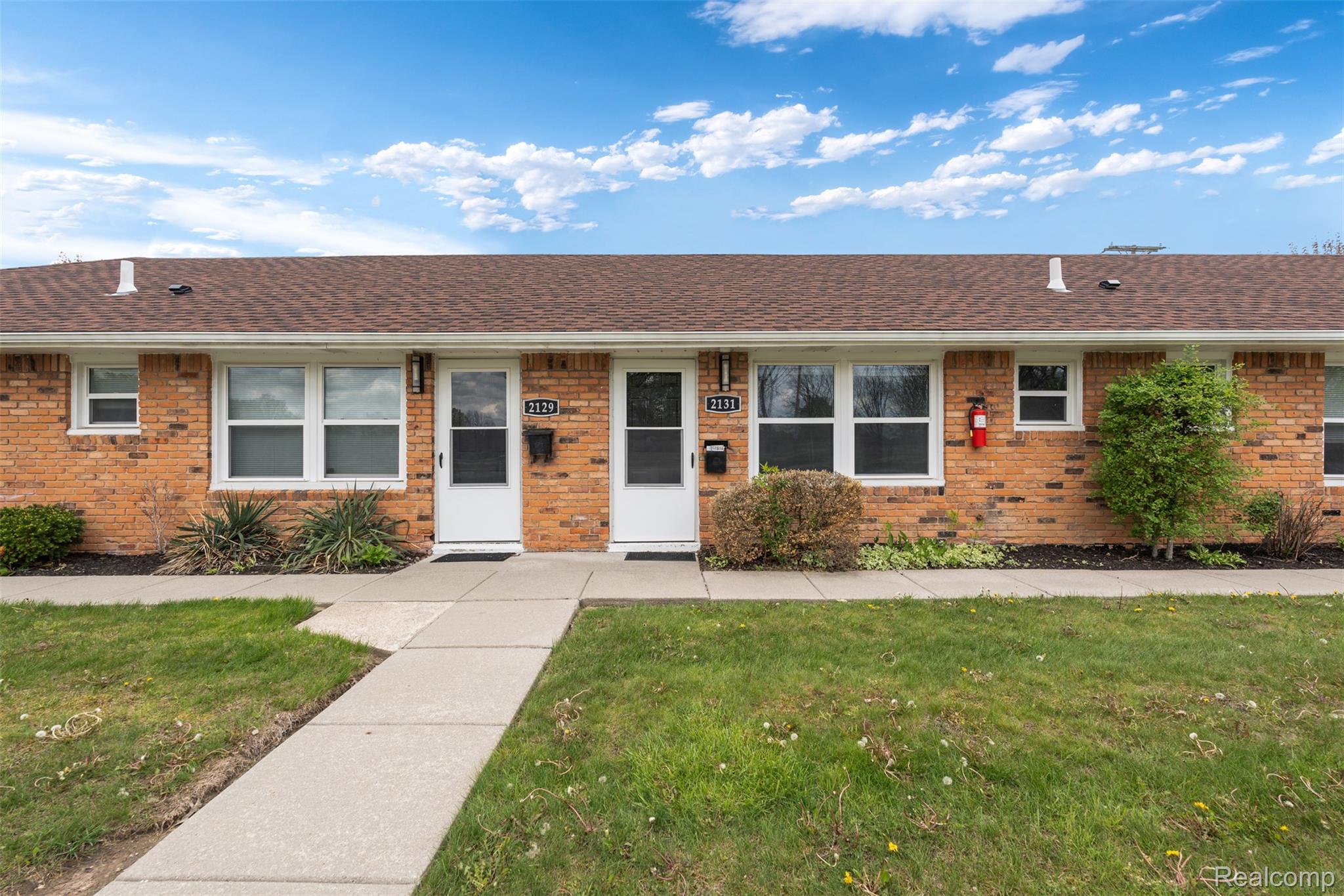 2131 Normandy Road Royal Oak, MI 48073 - Photo 1 of 11 Ranch-style home featuring a front yard, brick siding, and a shingled roof