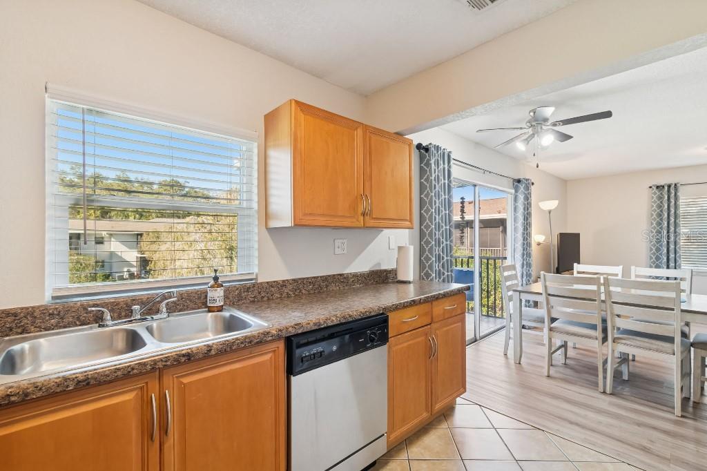 13125 Wilcox Road, Unit 6205 Largo, FL 33774 - Photo 13 of 48 a kitchen with stainless steel appliances granite countertop a sink stove and cabinets