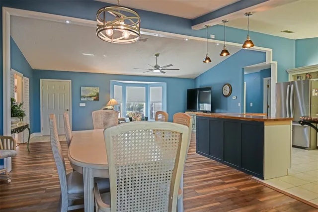 a kitchen with sink cabinets and appliances