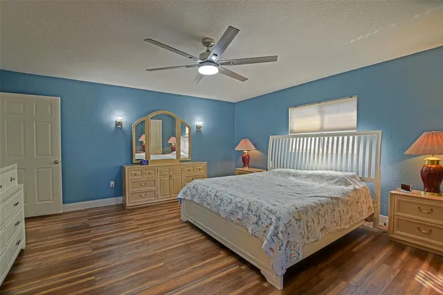 a bed room with a bed and a dresser