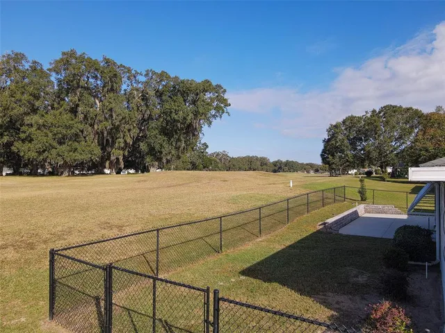 an aerial view of a house with outdoor space lake view and mountain view