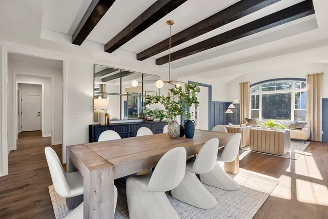 a view of a dining room with furniture window and wooden floor
