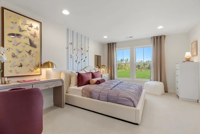 a bedroom with a bed and a couch