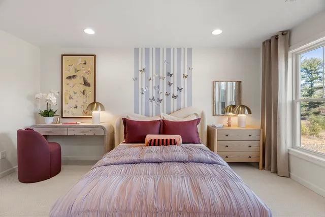 a bed room with a bed and a night stand