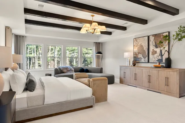 a spacious bathroom with a double vanity sink mirror and bathtub