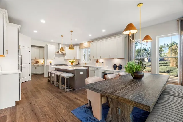 a large kitchen with cabinets a sink and appliances