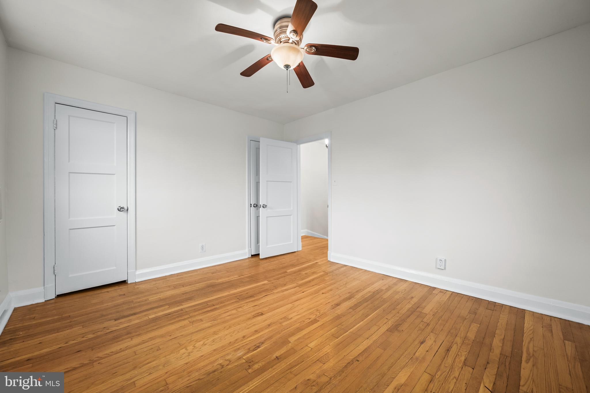 417 Random Road Baltimore, MD 21229 - Photo 14 of 32 a view of empty room with wooden floor