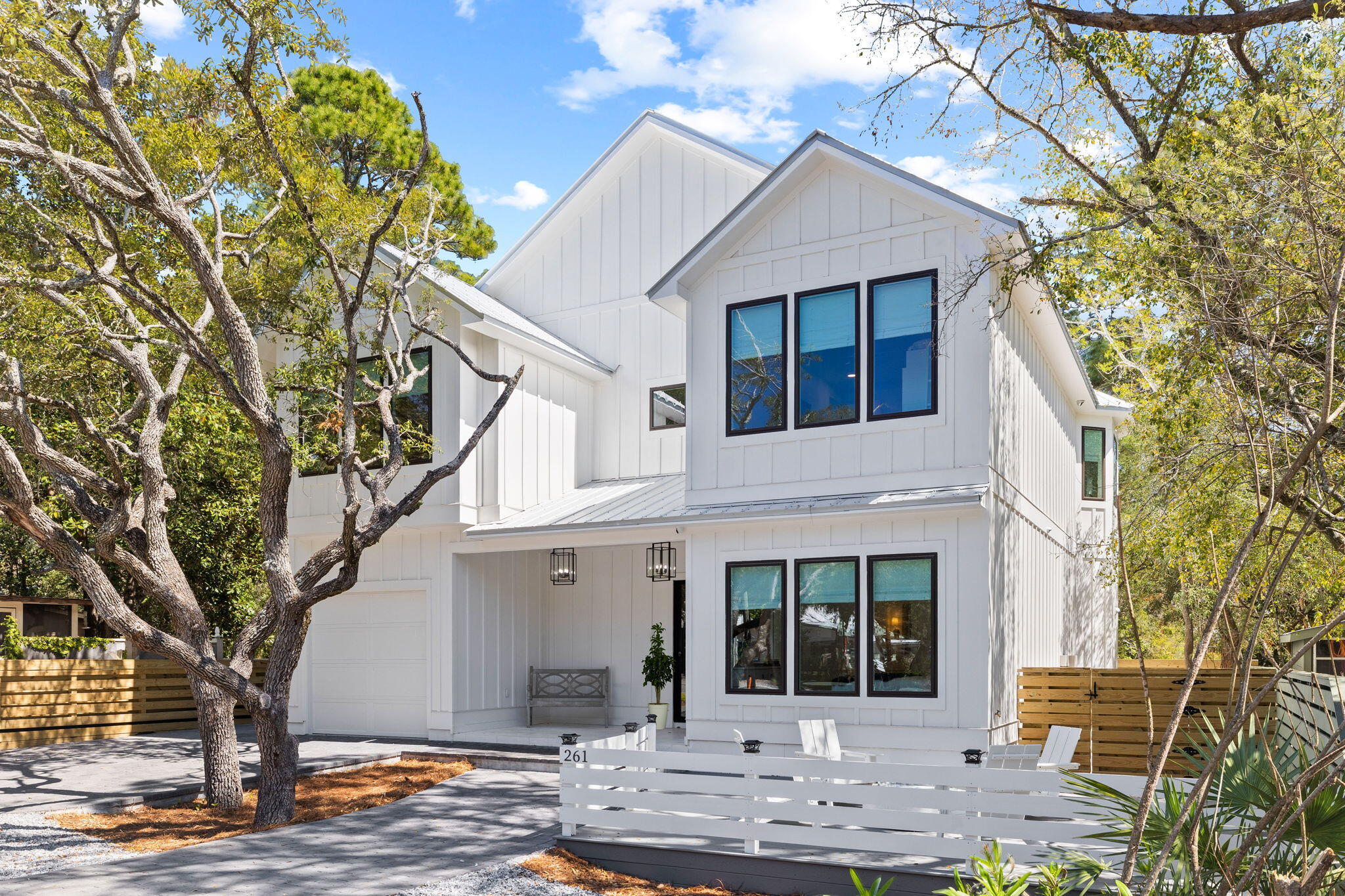 261 Defuniak Street Santa Rosa Beach, FL 32459 - Photo 1 of 27 a front view of a house with garden