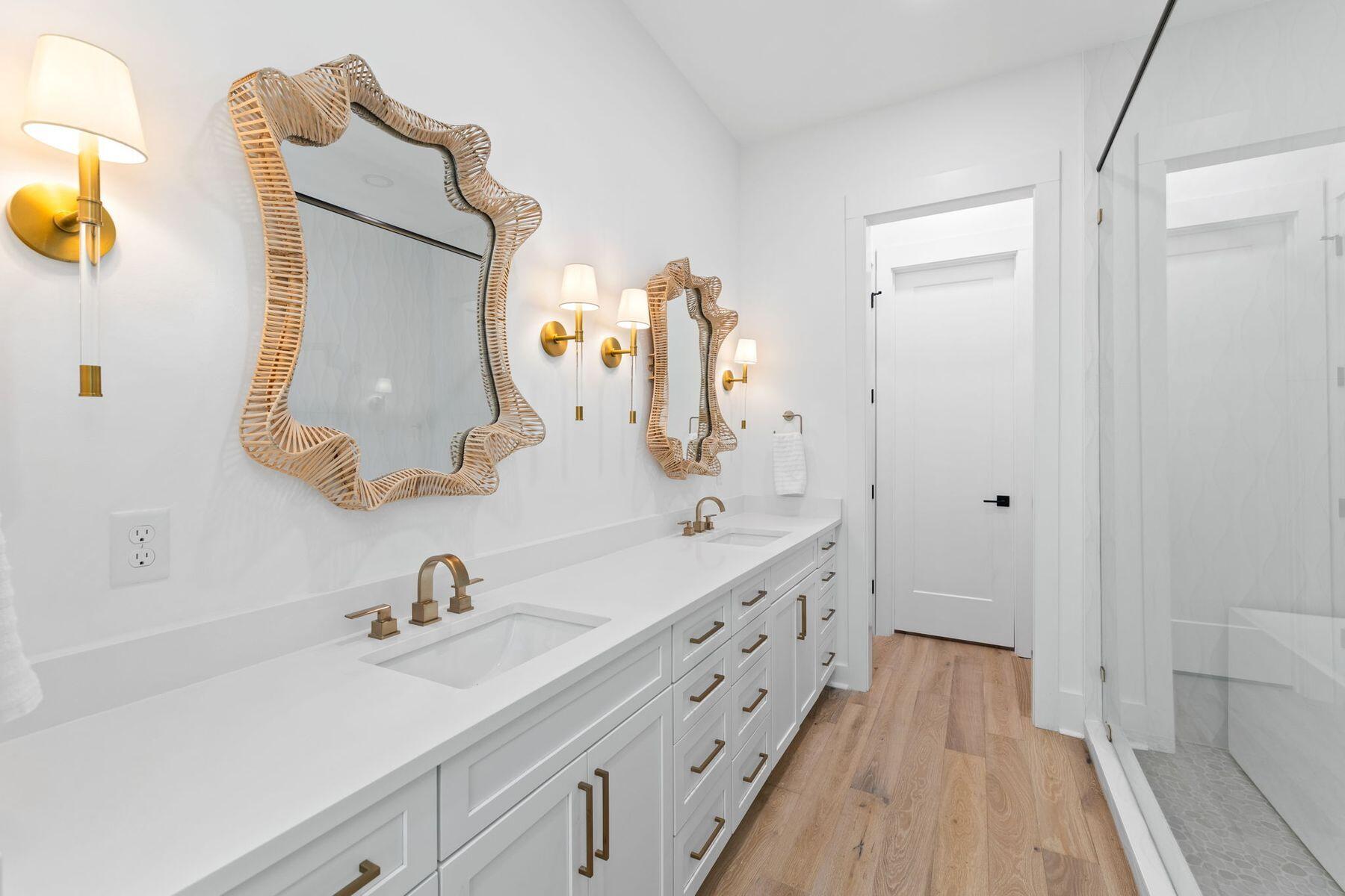 261 Defuniak Street Santa Rosa Beach, FL 32459 - Photo 12 of 27 a bathroom with a double vanity sink and mirror