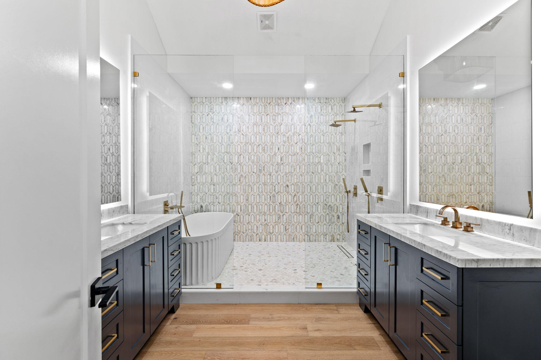 261 Defuniak Street Santa Rosa Beach, FL 32459 - Photo 19 of 27 a spacious bathroom with a double vanity sink toilet mirror and bathtub