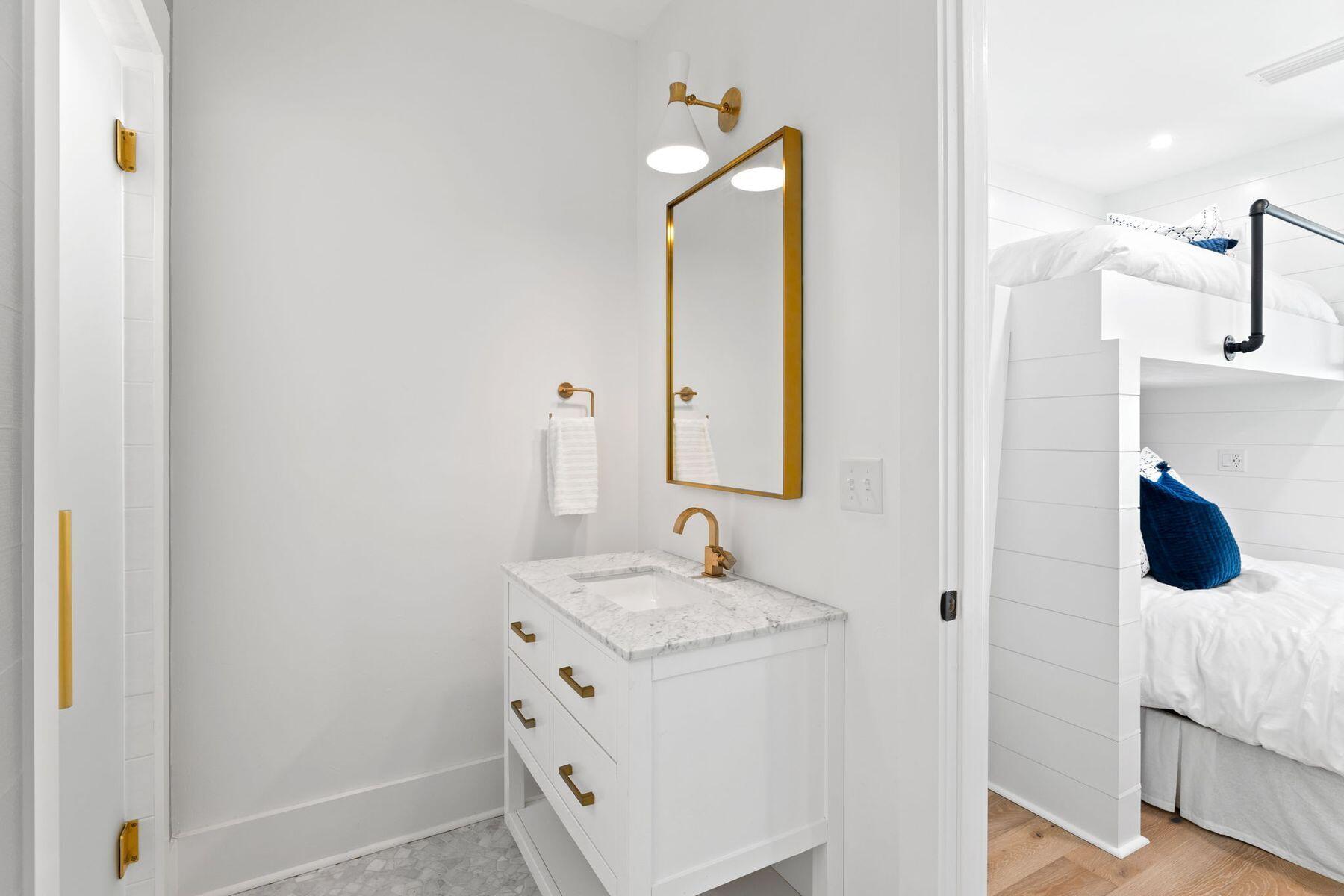 261 Defuniak Street Santa Rosa Beach, FL 32459 - Photo 23 of 27 a bathroom with a sink and a mirror