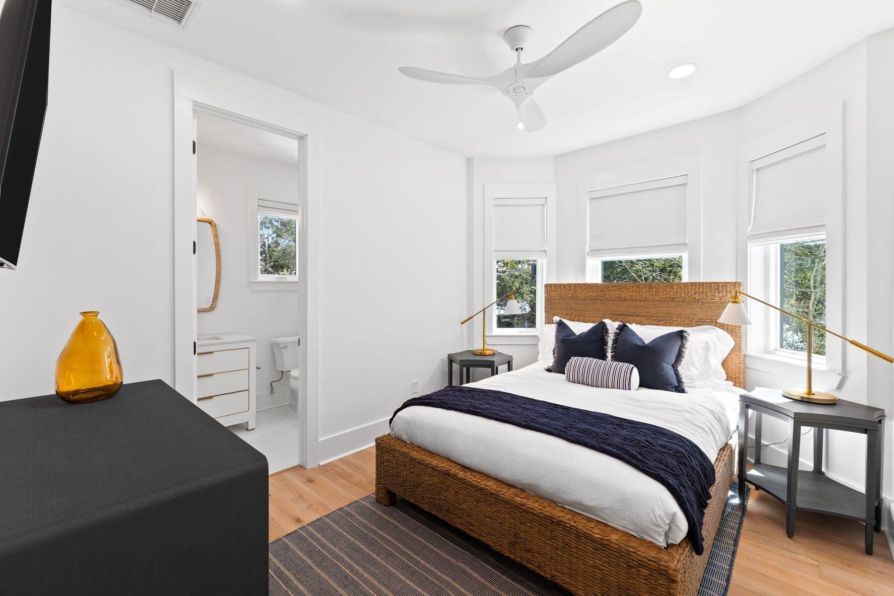 261 Defuniak Street Santa Rosa Beach, FL 32459 - Photo 25 of 27 a bedroom with a bed a couch and dresser