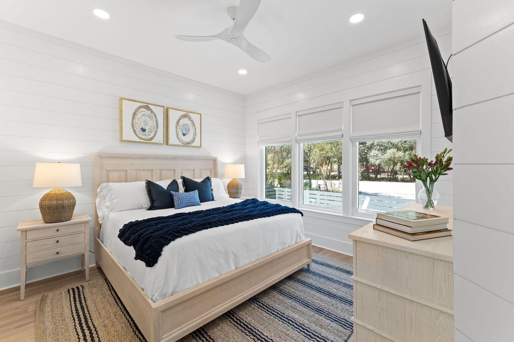 261 Defuniak Street Santa Rosa Beach, FL 32459 - Photo 8 of 27 a bedroom with a bed and a window