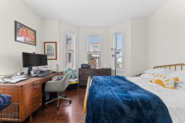 a bedroom with a bed and a table in it