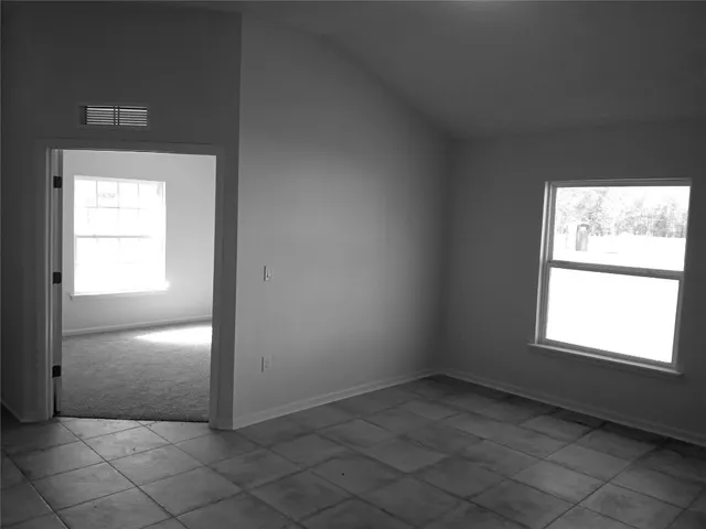 an empty room with windows