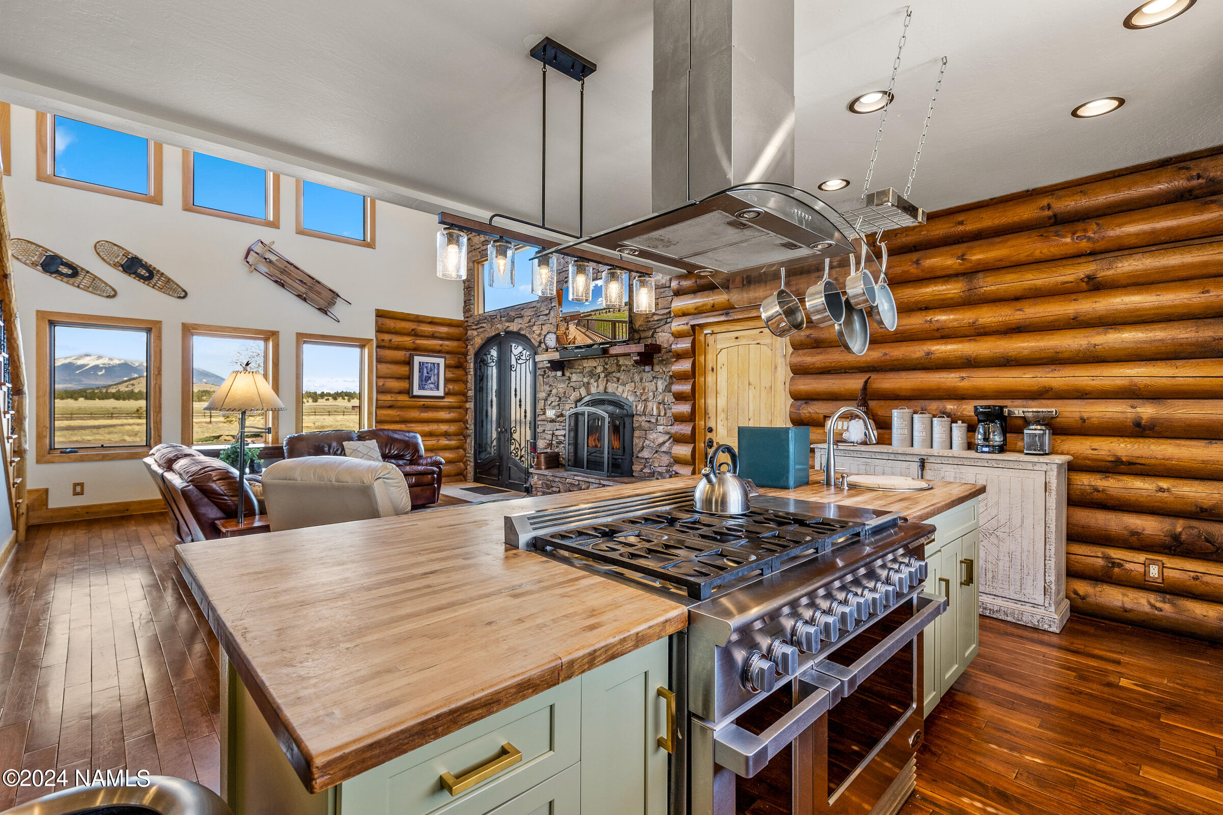 3130 North Spring Valley Road Parks, AZ 86018 - Photo 13 of 48 a kitchen with a stove and a table