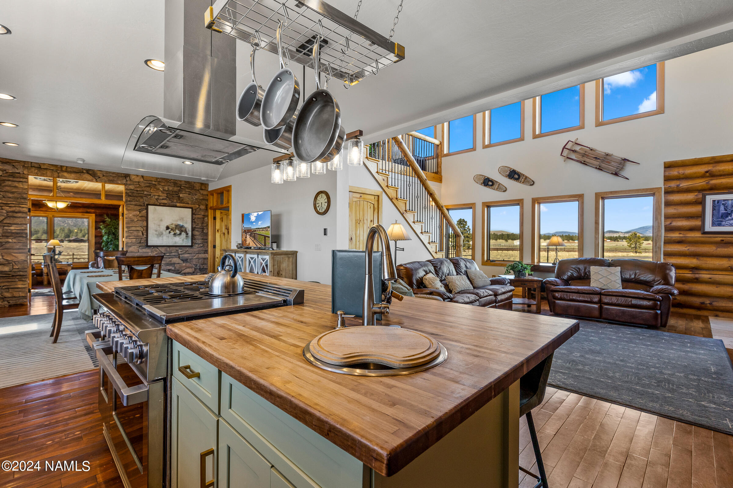 3130 North Spring Valley Road Parks, AZ 86018 - Photo 17 of 48 a kitchen with a table and chairs in it