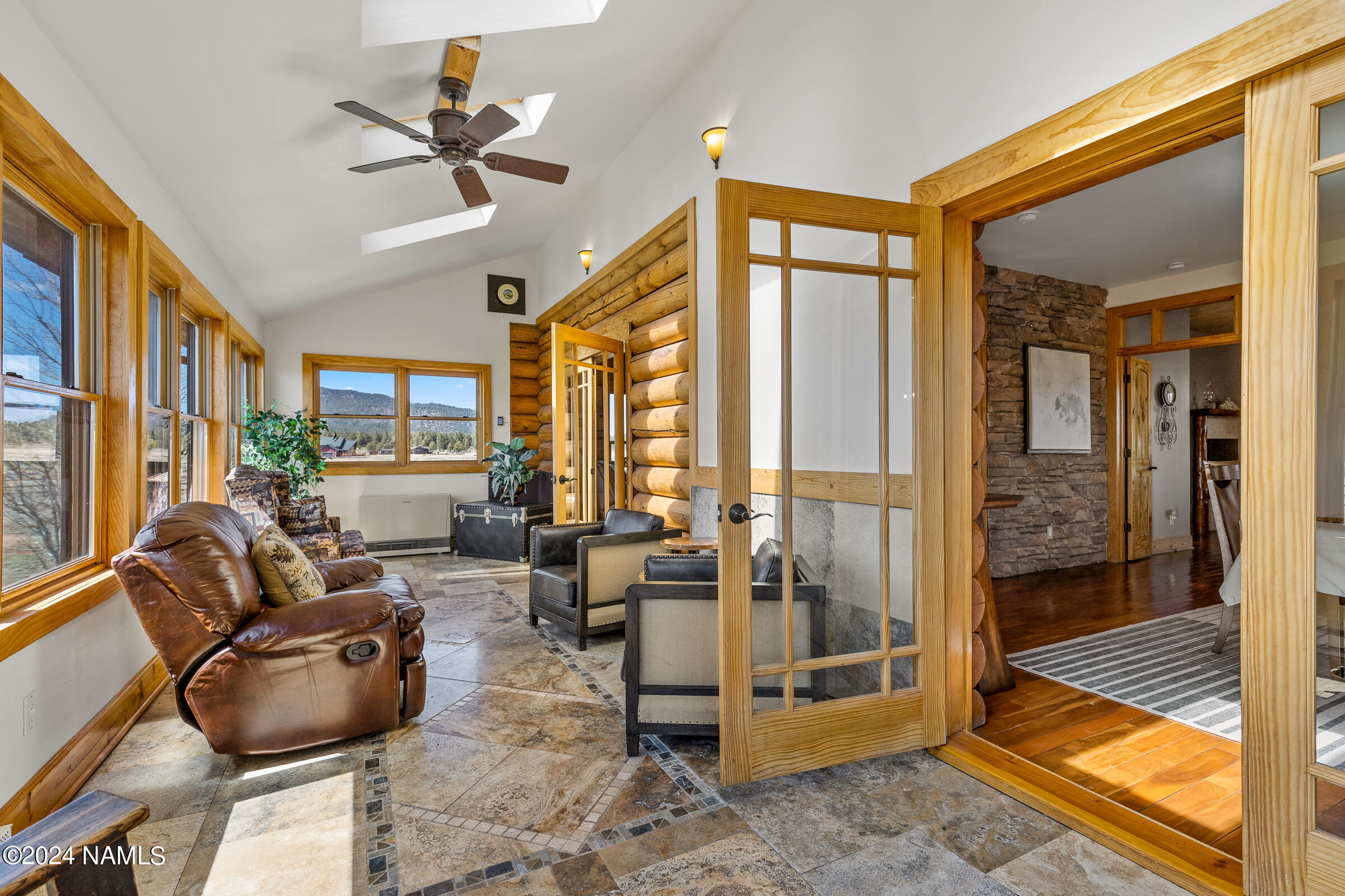 3130 North Spring Valley Road Parks, AZ 86018 - Photo 19 of 48 a living room with furniture and a floor to ceiling window
