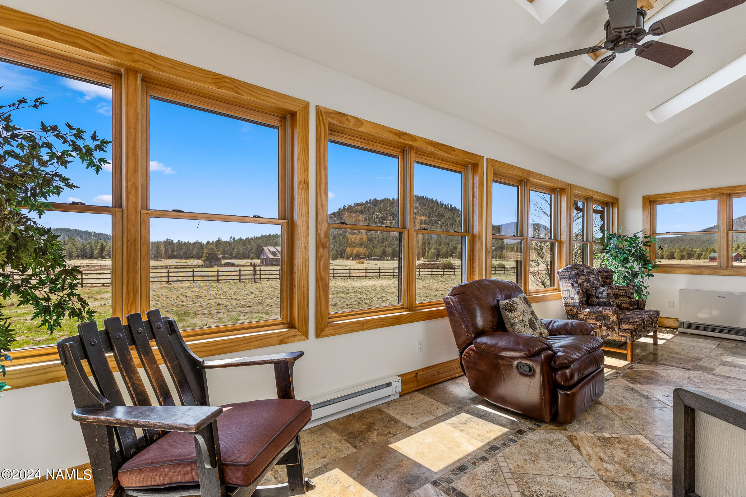 3130 North Spring Valley Road Parks, AZ 86018 - Photo 20 of 48 a living room with furniture and a floor to ceiling window