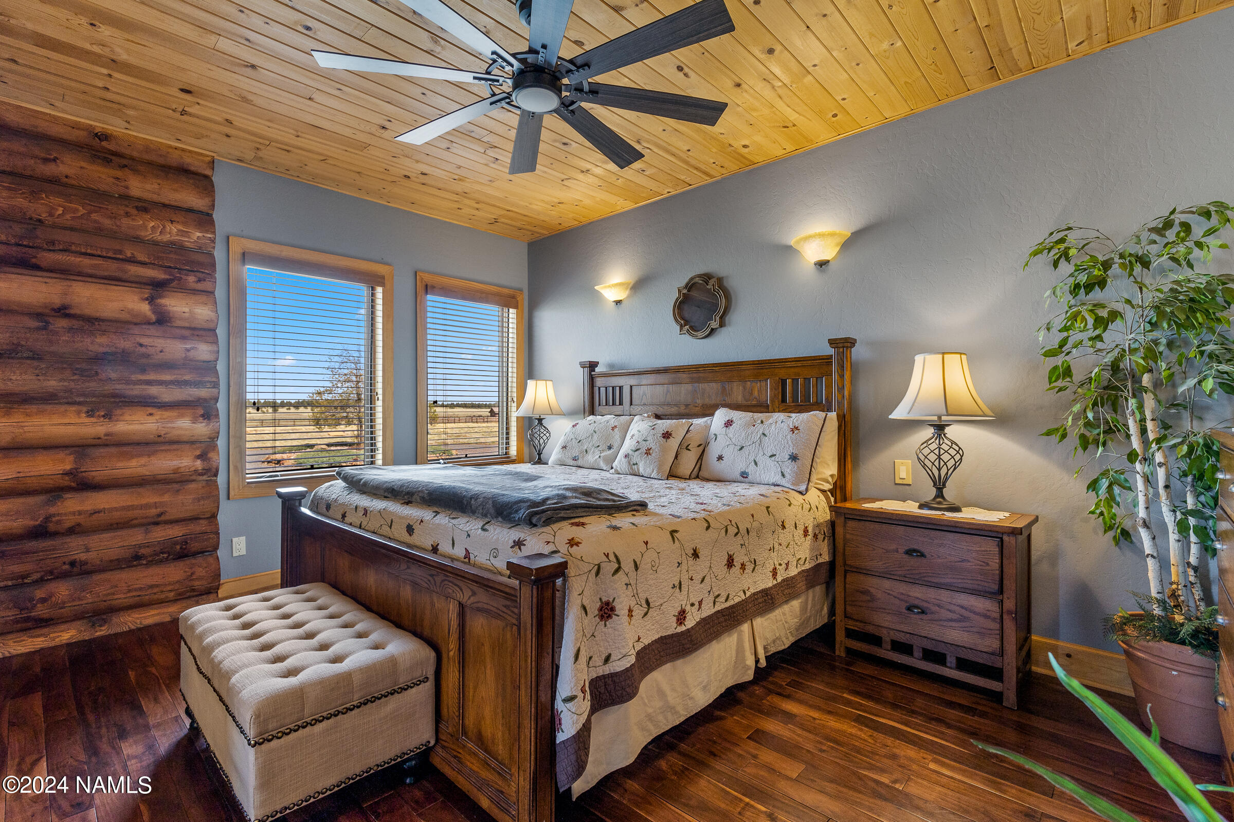 3130 North Spring Valley Road Parks, AZ 86018 - Photo 21 of 48 a bedroom with a bed and a chandelier