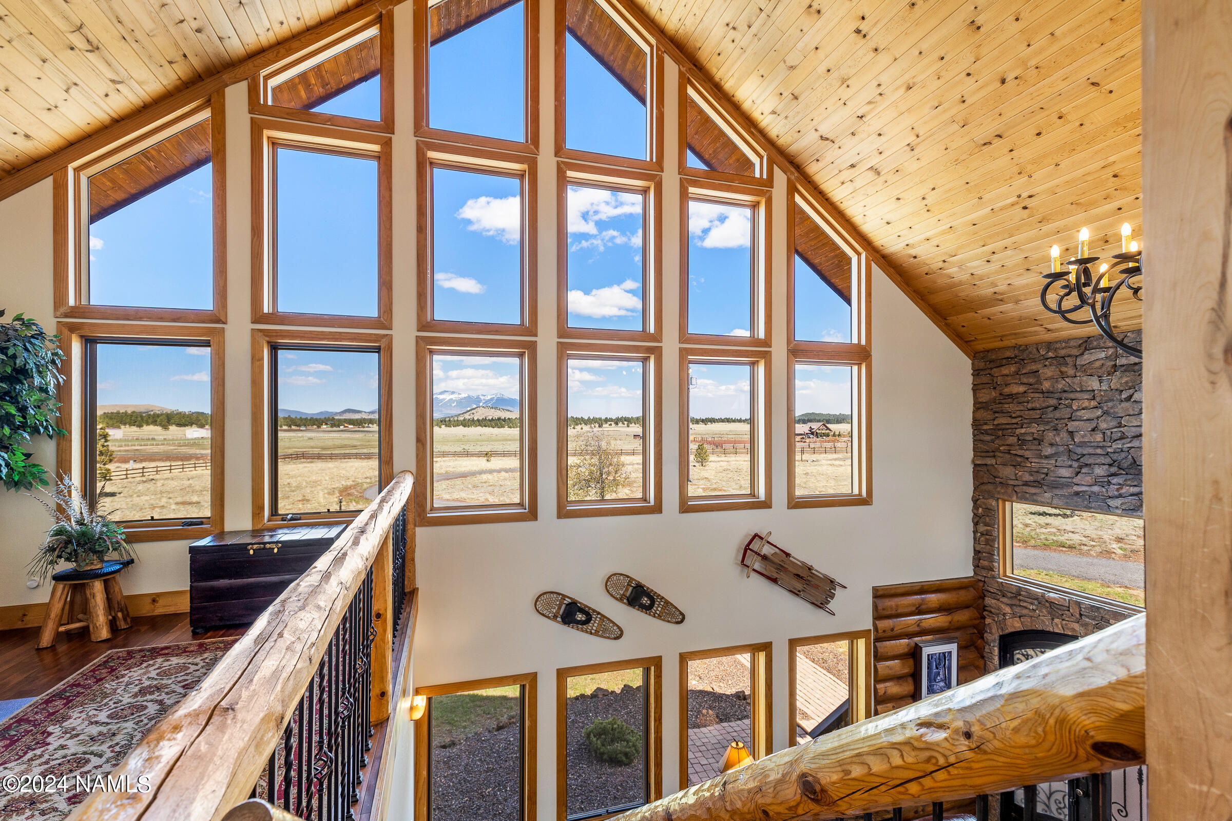 3130 North Spring Valley Road Parks, AZ 86018 - Photo 28 of 48 a view of an buildings from a balcony with seating space