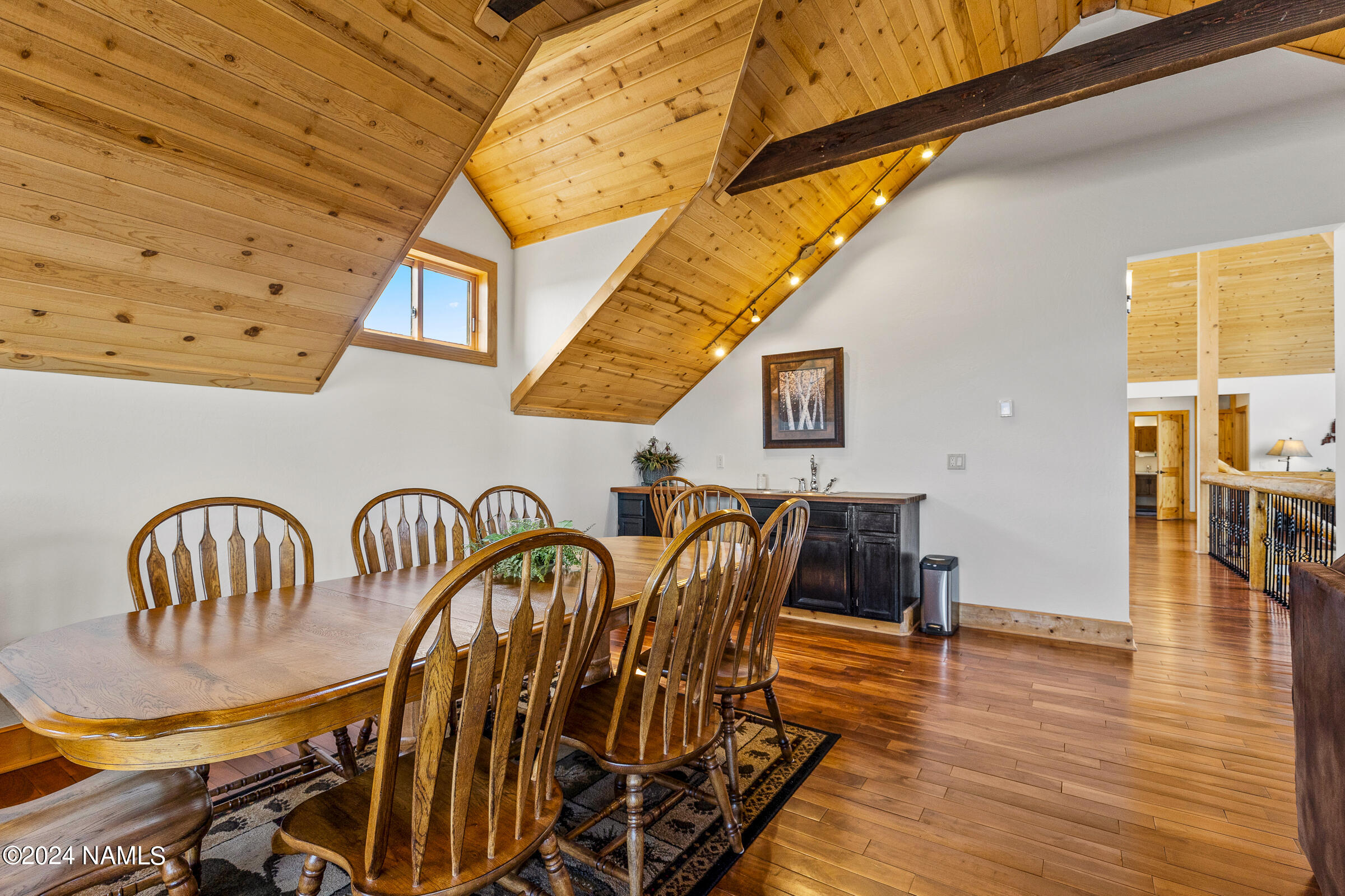 3130 North Spring Valley Road Parks, AZ 86018 - Photo 32 of 48 a view of a dining room with furniture and wooden floor