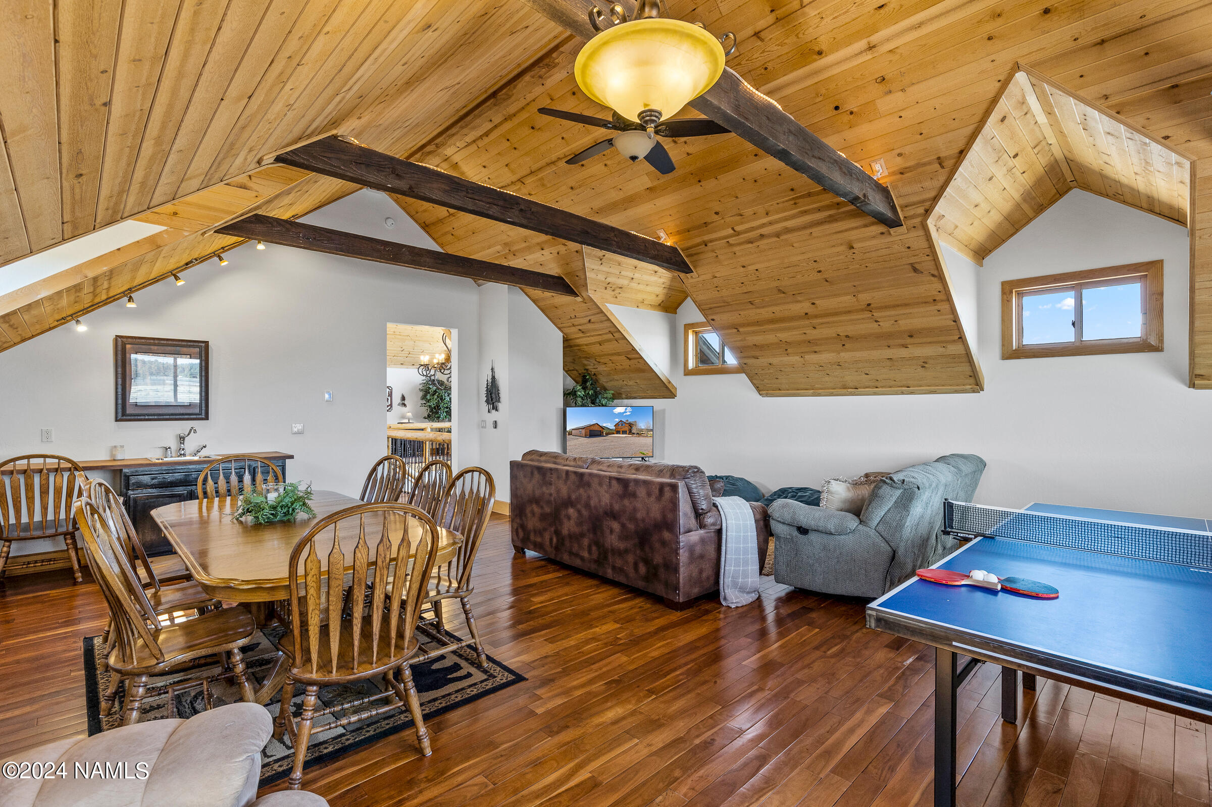 3130 North Spring Valley Road Parks, AZ 86018 - Photo 33 of 48 a living room with furniture and a wooden floor