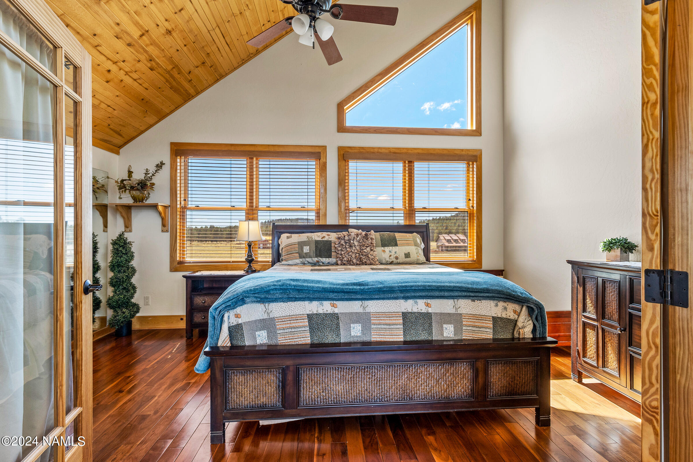 3130 North Spring Valley Road Parks, AZ 86018 - Photo 34 of 48 a bedroom with a bed window and a table
