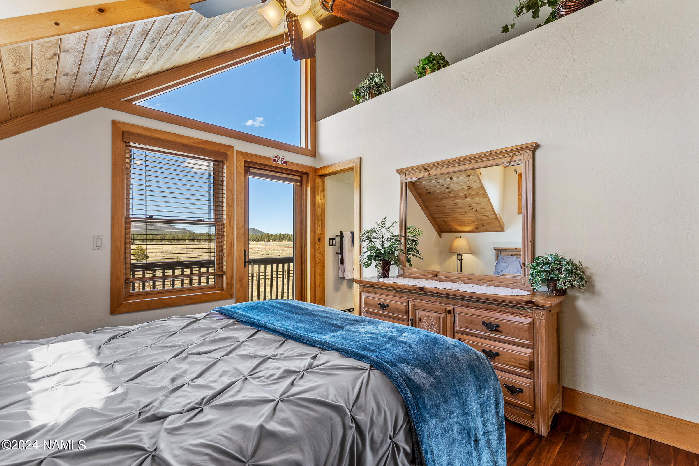 3130 North Spring Valley Road Parks, AZ 86018 - Photo 39 of 48 a bedroom with a large bed and a large window