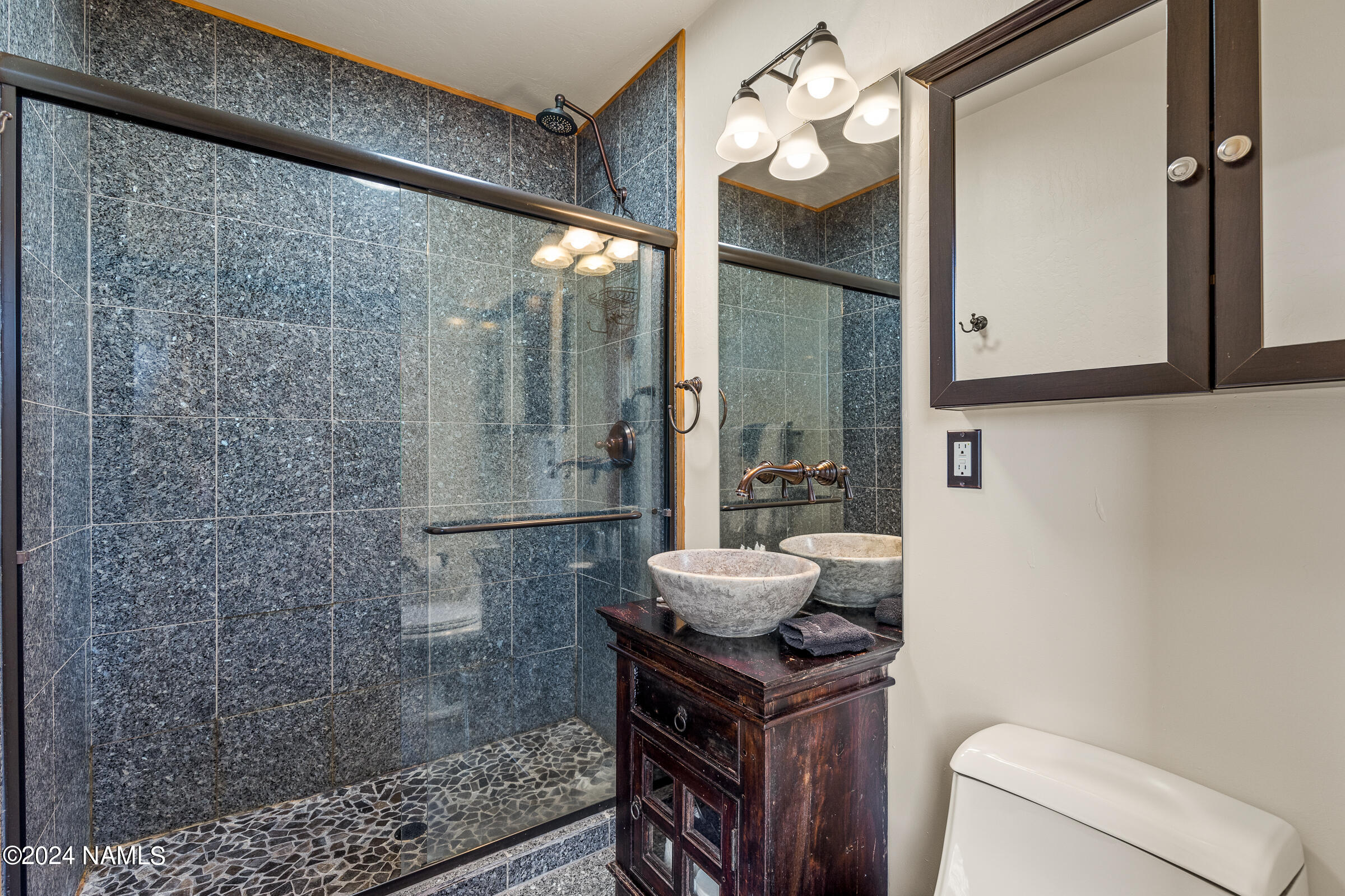 3130 North Spring Valley Road Parks, AZ 86018 - Photo 40 of 48 a bathroom with a sink a toilet and shower