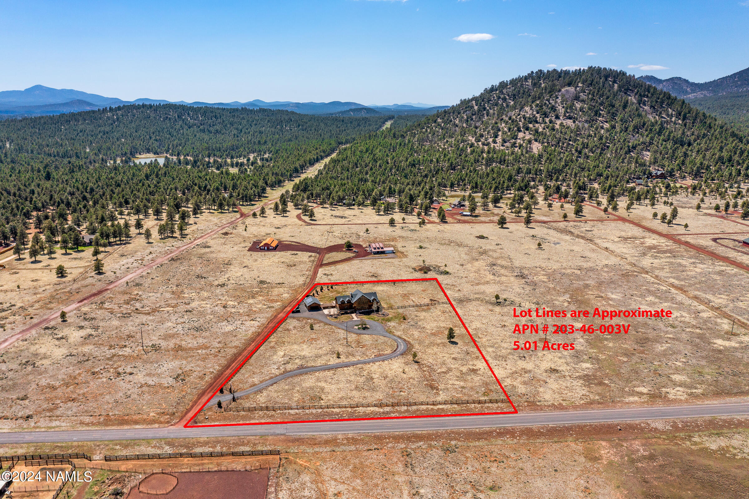 3130 North Spring Valley Road Parks, AZ 86018 - Photo 48 of 48 a view of a yard with a tree