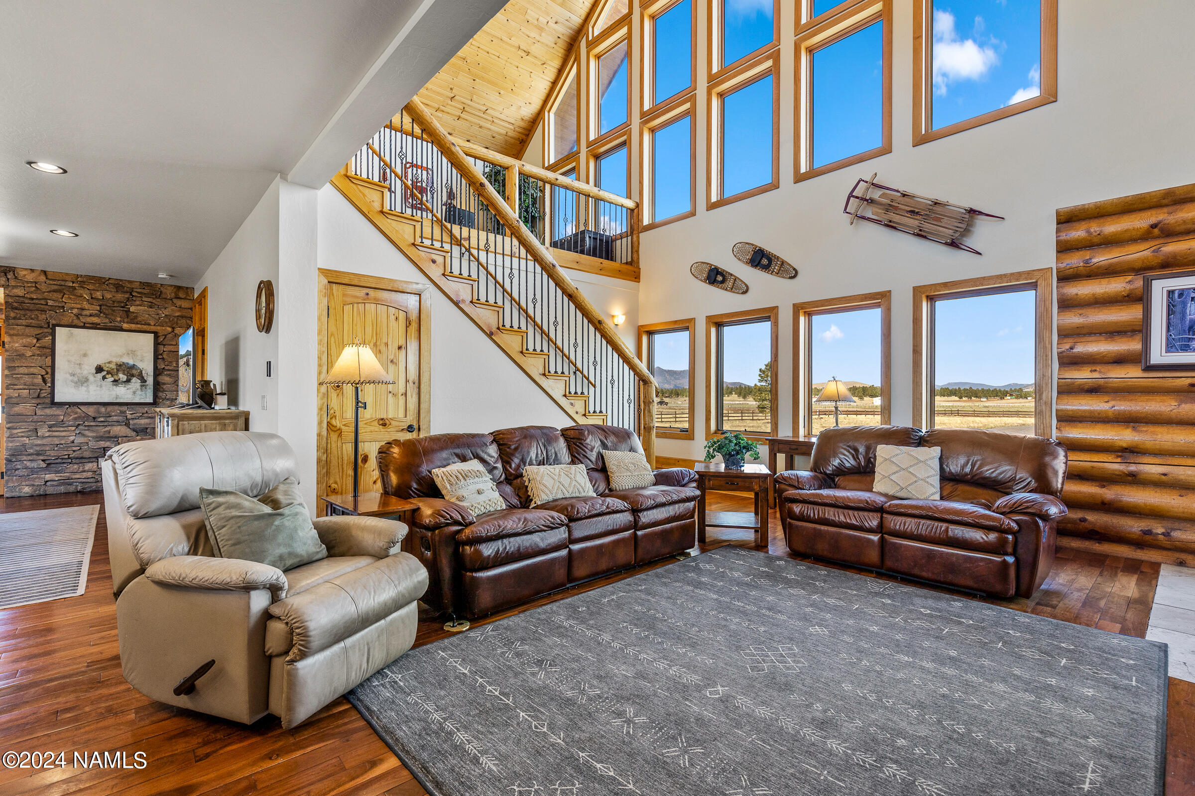 3130 North Spring Valley Road Parks, AZ 86018 - Photo 7 of 48 a living room with furniture and a large window