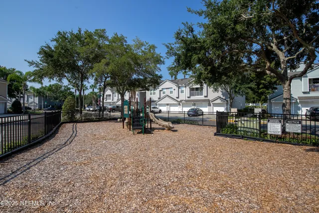 a view of a pathway with house on both side