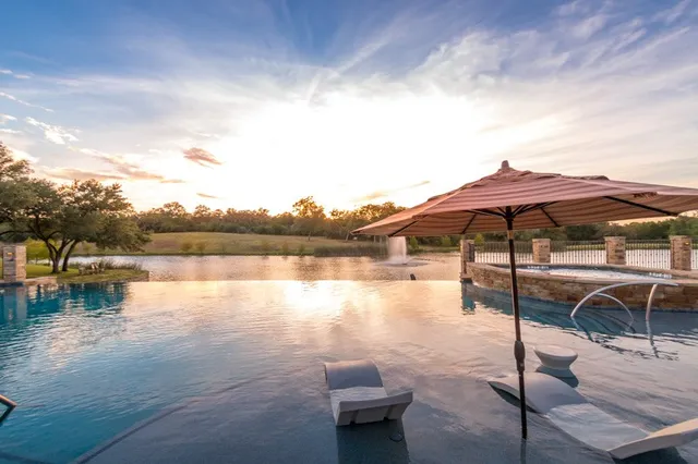 a view of lake with outdoor seating and lake