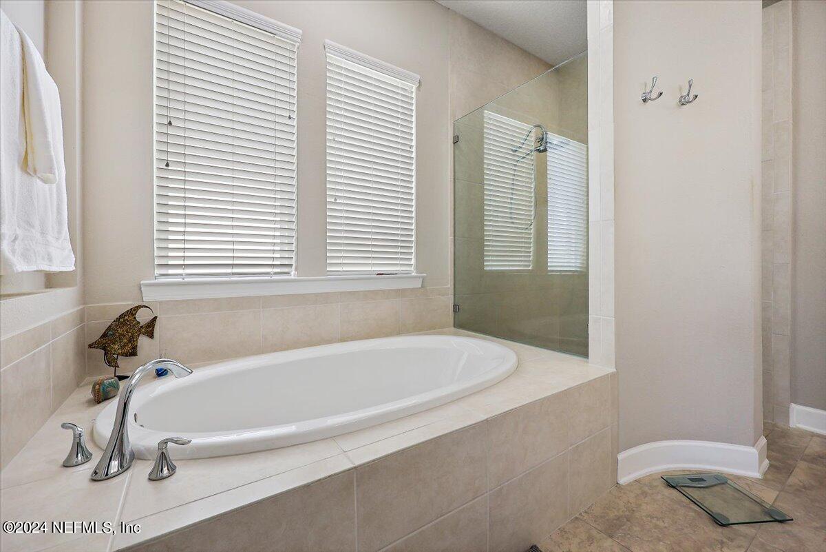 778 Glenneyre Circle St. Augustine, FL 32092 - Photo 13 of 40 a white bath tub sitting next to a shower