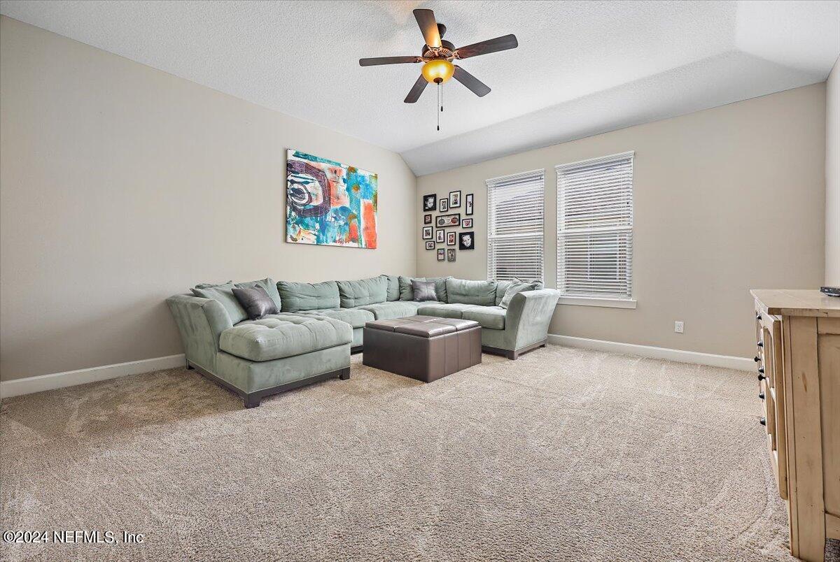 778 Glenneyre Circle St. Augustine, FL 32092 - Photo 15 of 40 a living room with furniture and a window