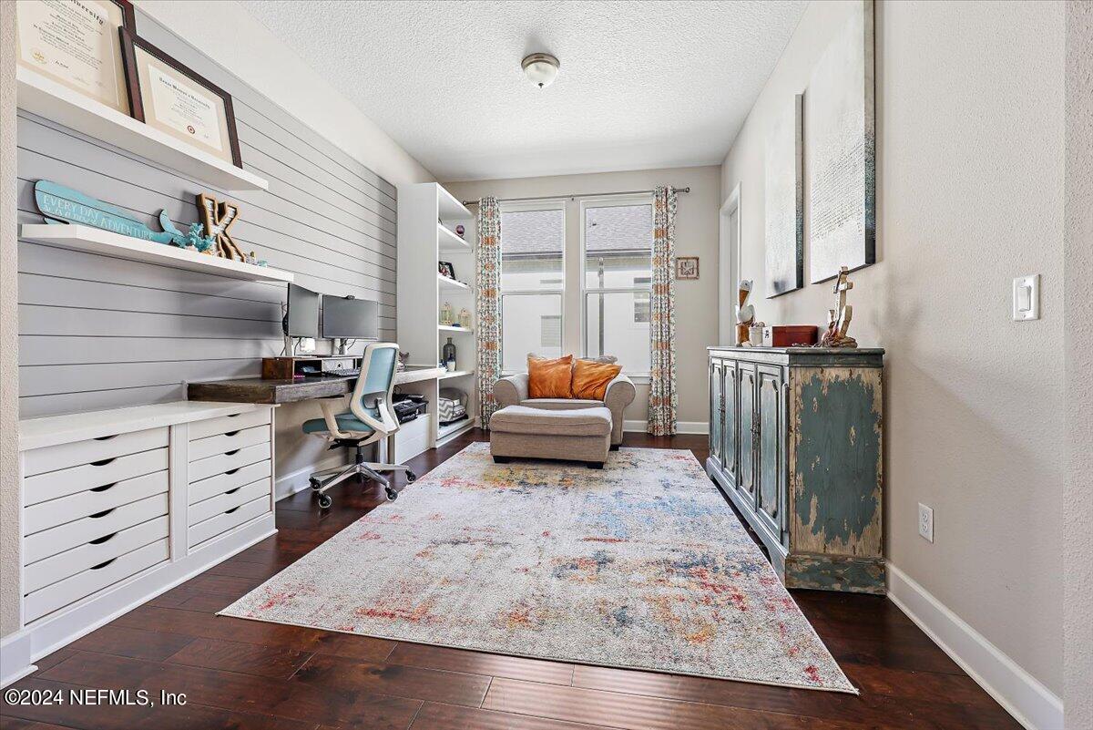 778 Glenneyre Circle St. Augustine, FL 32092 - Photo 3 of 40 a living room with furniture and a flat screen tv