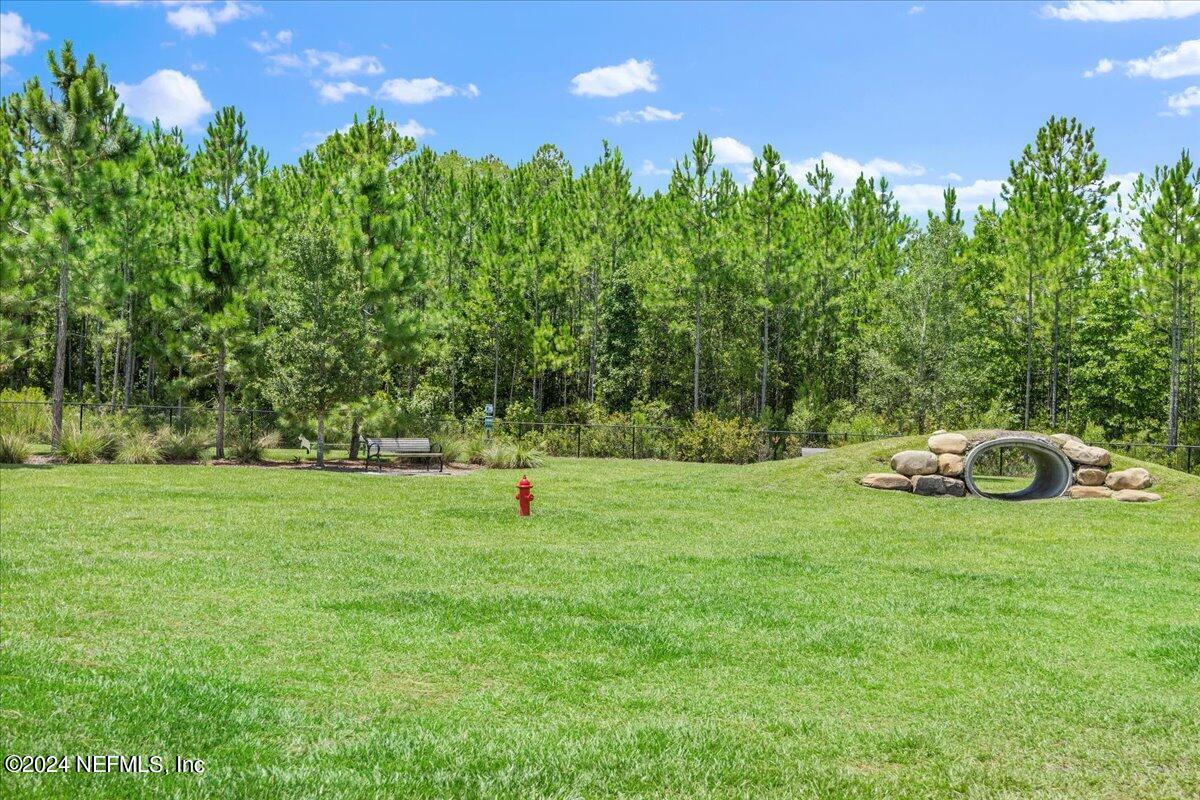 778 Glenneyre Circle St. Augustine, FL 32092 - Photo 36 of 40 a view of a field of grass and trees