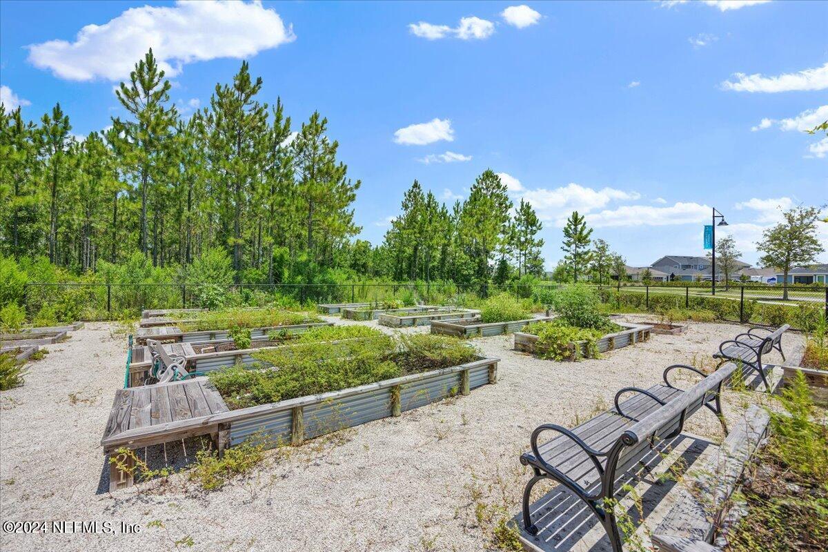 778 Glenneyre Circle St. Augustine, FL 32092 - Photo 38 of 40 a view of a swimming pool and lounge chairs