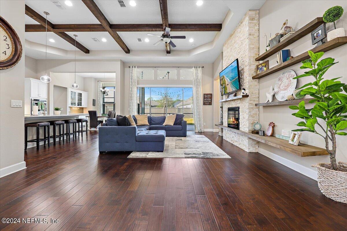 778 Glenneyre Circle St. Augustine, FL 32092 - Photo 5 of 40 a living room with furniture and a fireplace
