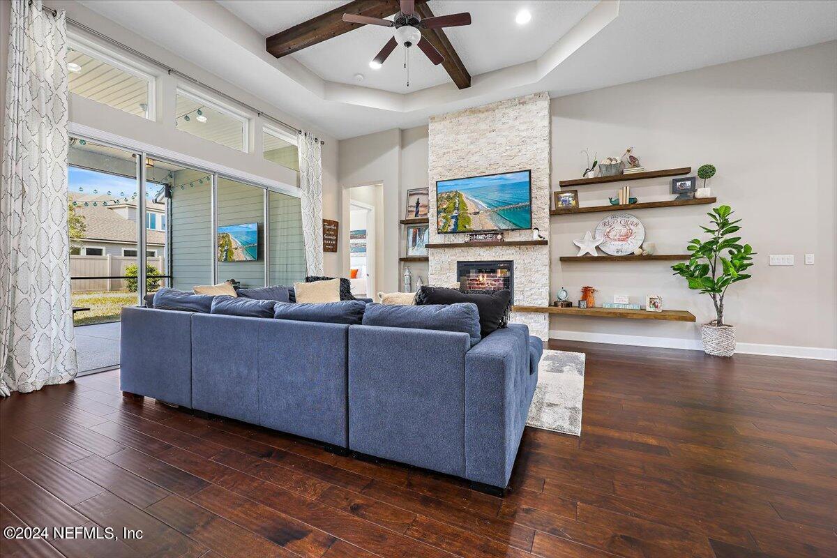 778 Glenneyre Circle St. Augustine, FL 32092 - Photo 6 of 40 a living room with furniture and a fireplace