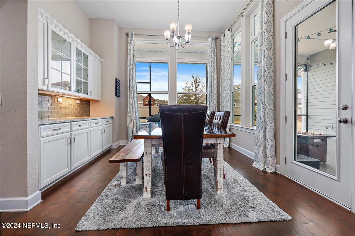 778 Glenneyre Circle St. Augustine, FL 32092 - Photo 10 of 40 a view of a dining room with furniture window and wooden floor