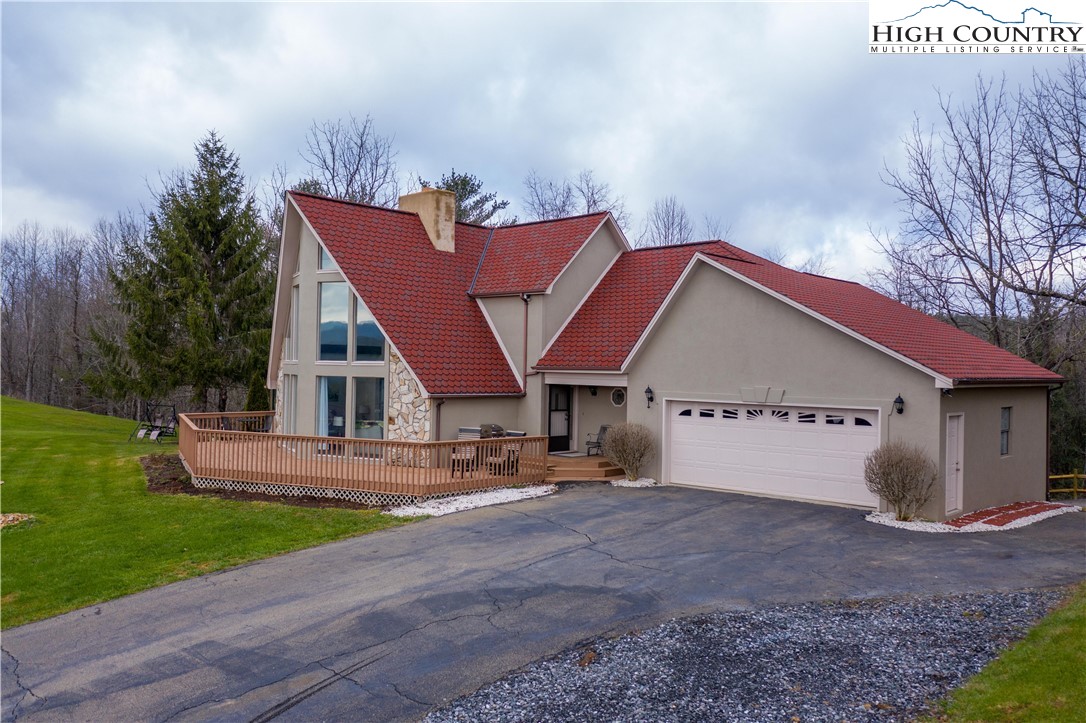 346 Clear View Ridge Crumpler, NC 28617 - Photo 1 of 41 a view of a house with a yard and sitting area
