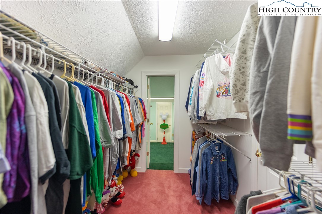346 Clear View Ridge Crumpler, NC 28617 - Photo 27 of 41 a view of walk in closet with clothes and shoes