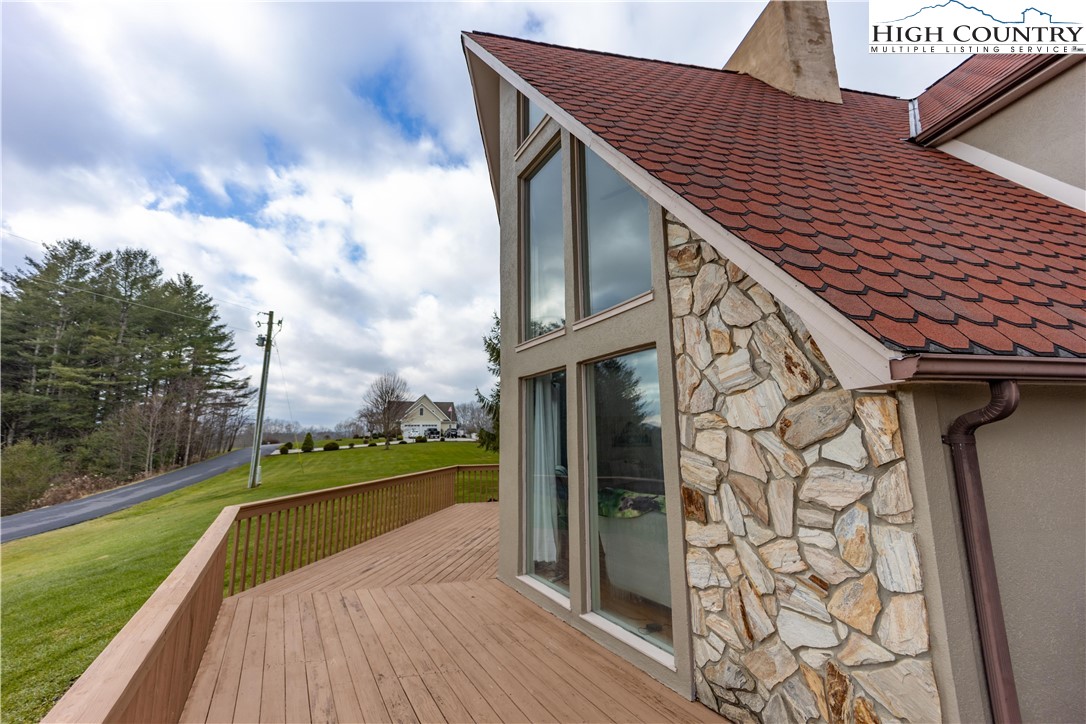 346 Clear View Ridge Crumpler, NC 28617 - Photo 40 of 41 a balcony with wooden floor and lake view